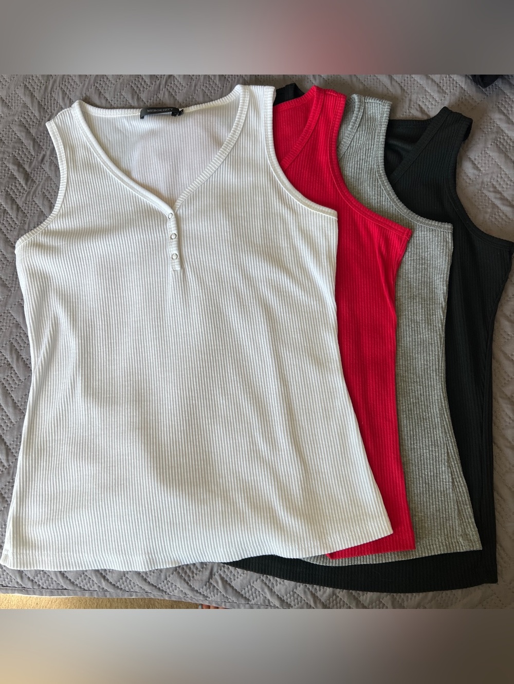 Set of 4 sleeveless ribbed Henley tanks- $40 for all
Women’s size L